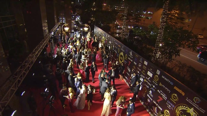 An overhead evening view of guests gathered along the red carpet at CAEL in 2023.